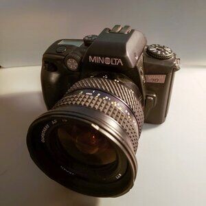 Minolta Maxxum 7 (35mm film camera + lenses)